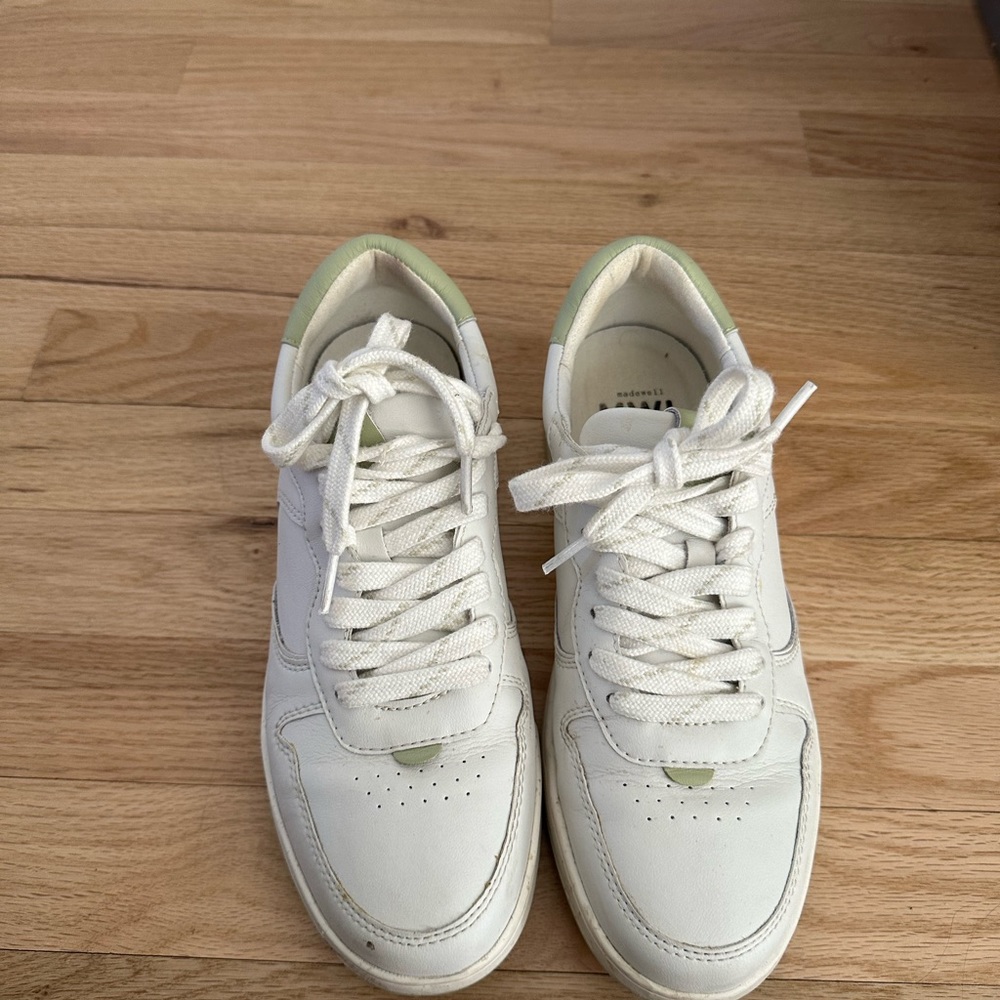 Very gently worn white sneakers with mint green accent.